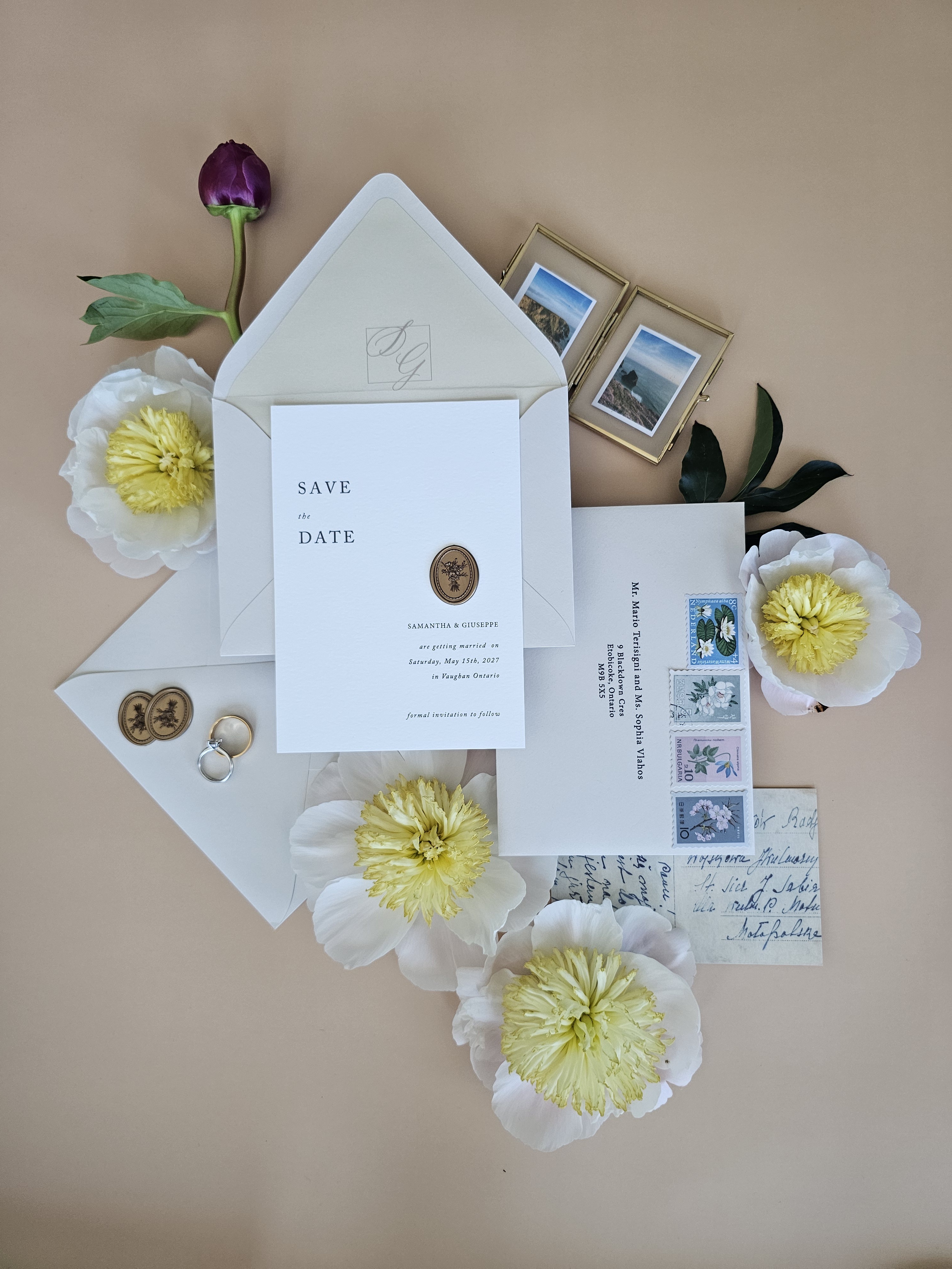 Save the Date flat lay with peonies, wax seal and monogram envelope